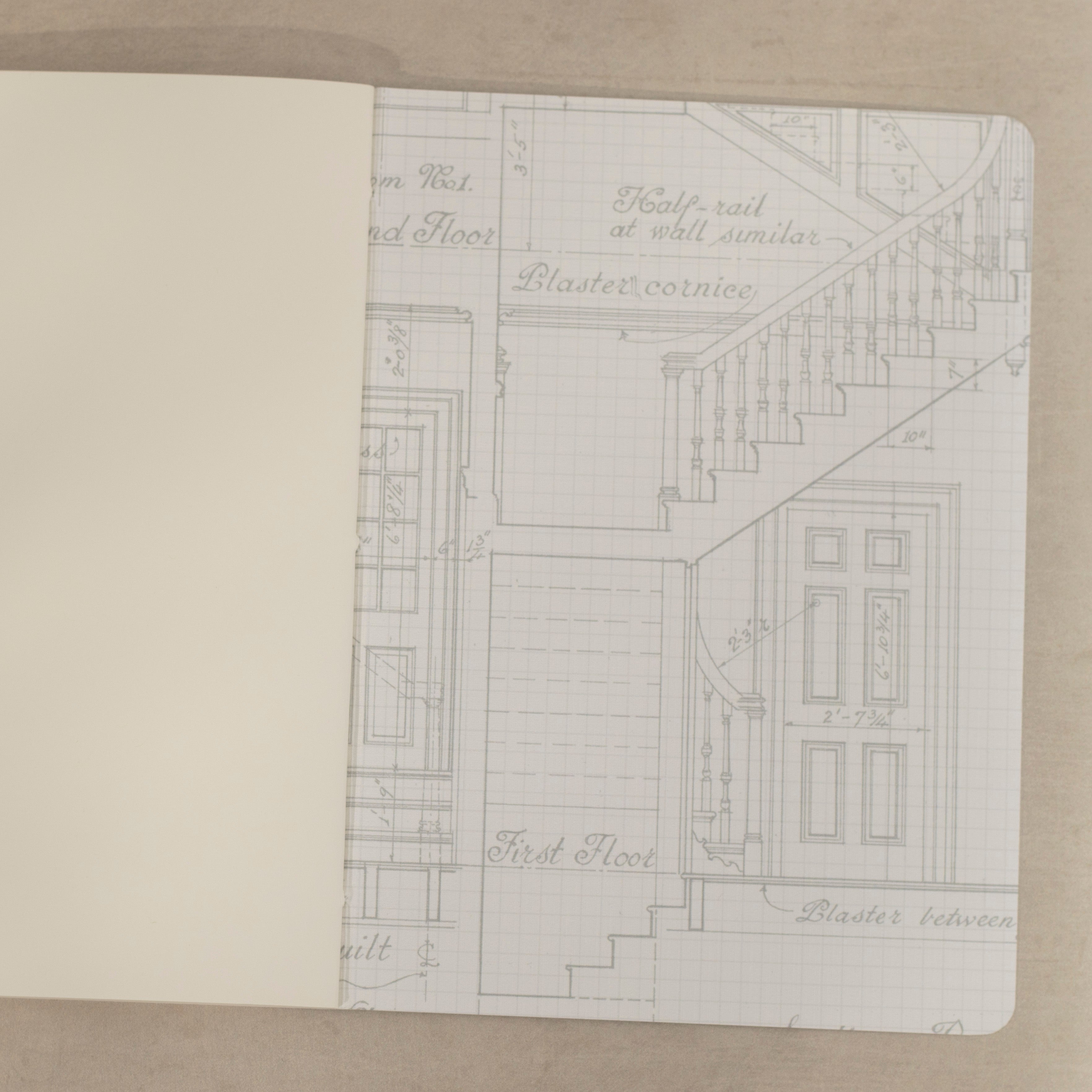 Open notebook with an architectural plan of Laurel Hill Mansion on a neutral background.
