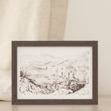 Framed print of a landscape drawing on a neutral backdrop. 