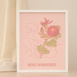 Framed artwork with floral design and 'REINE MARGUERITE' text on a pink background against a neutral backdrop.