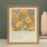 Framed floral print with a poppy illustration and a quote on a green backdrop. “To accomplish great things, we must not only act, but also dream; not only plan, but also believe.” The text reads Anatole France on the bottom right.