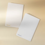 Back of the sun and moon notebooks on a beige background