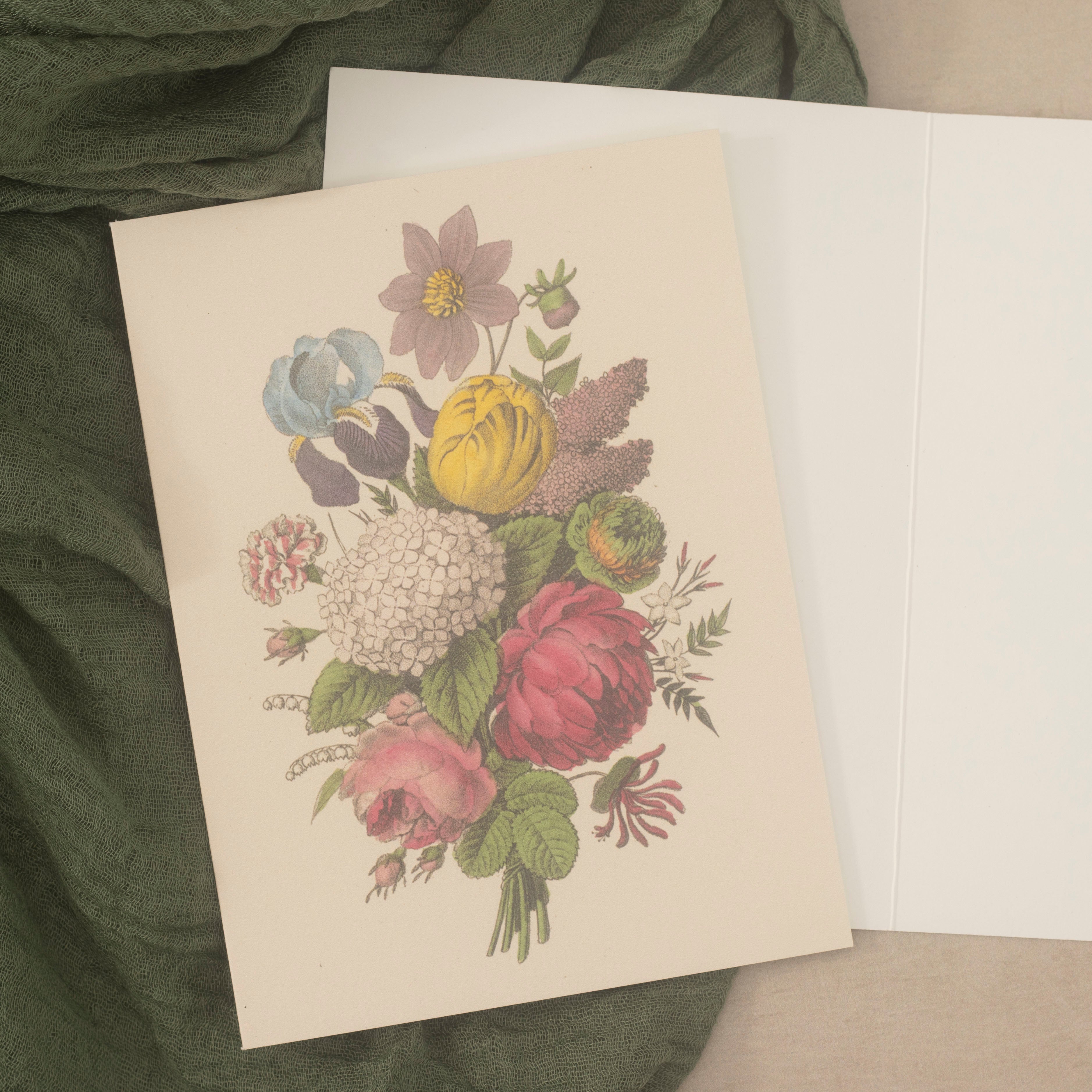 A vintage-style botanical art print card featuring a colorful bouquet of flowers on an open card.