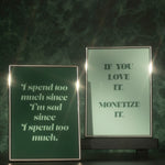 Two quote prints one is dark green and other other is light green in silver frames.